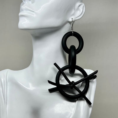 BLACK RUBBER EARRINGS WITH SILVER OR GOLD TONE EAR HOOKS. by nyet jewelry