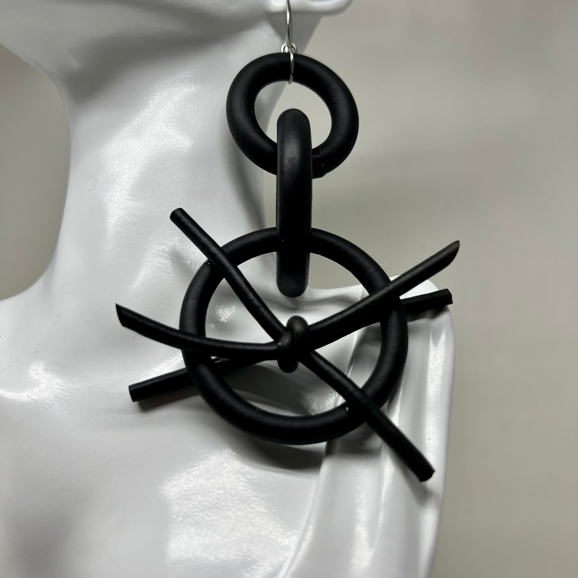 BLACK RUBBER EARRINGS WITH SILVER OR GOLD TONE EAR HOOKS. by nyet jewelry