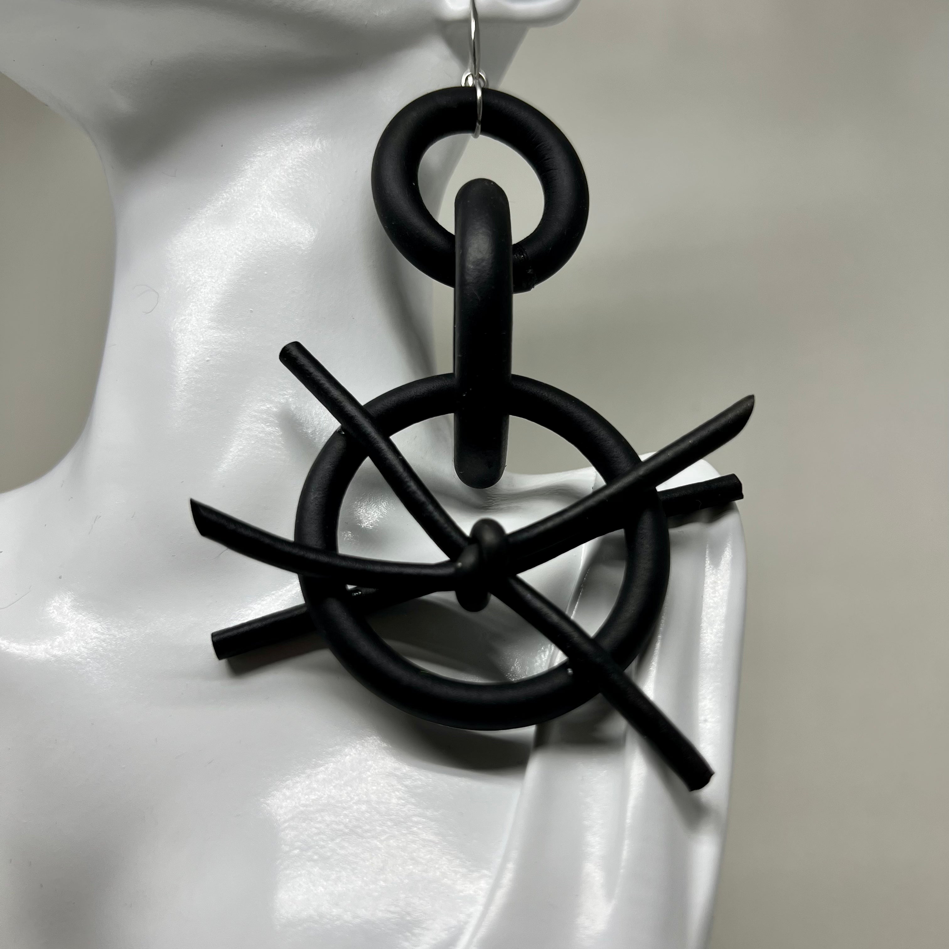 BLACK RUBBER EARRINGS WITH SILVER OR GOLD TONE EAR HOOKS. by nyet jewelry