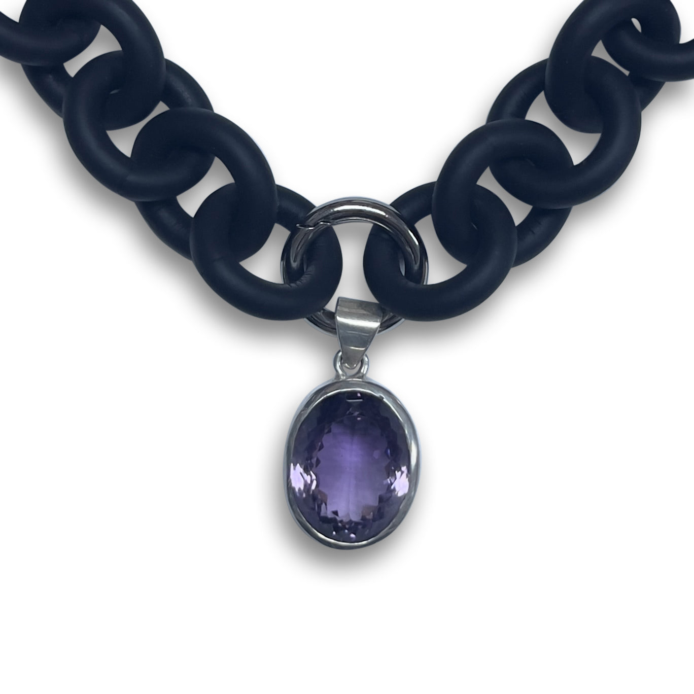 BLACK RUBBER NECKLACE WITH PENDENT BEZEL SET IN SILVER WITH A LARGE PURPLE AMETHYST STONE.