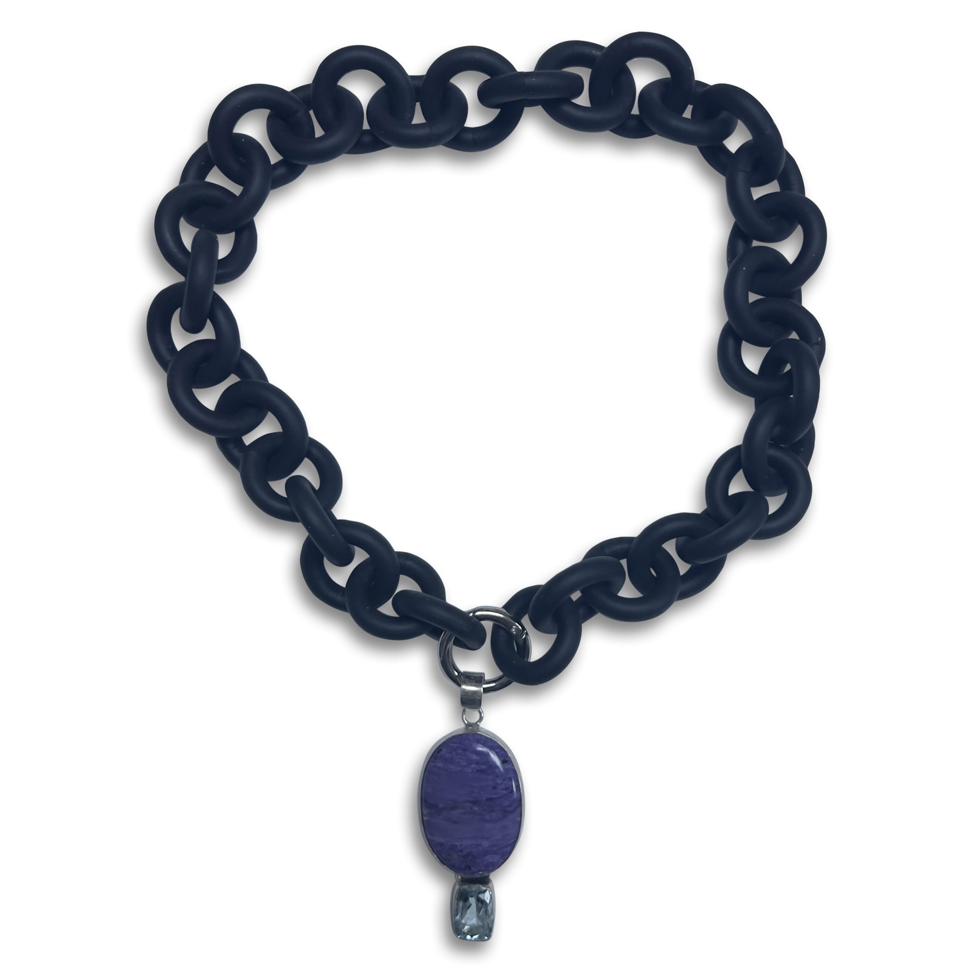 BLACK RUBBER NECKLACE WITH PENDENT BEZEL SET IN SILVER WITH A LARGE CHAROITE STONE AND A LIGHT BLUE TOPAZ STONE.
