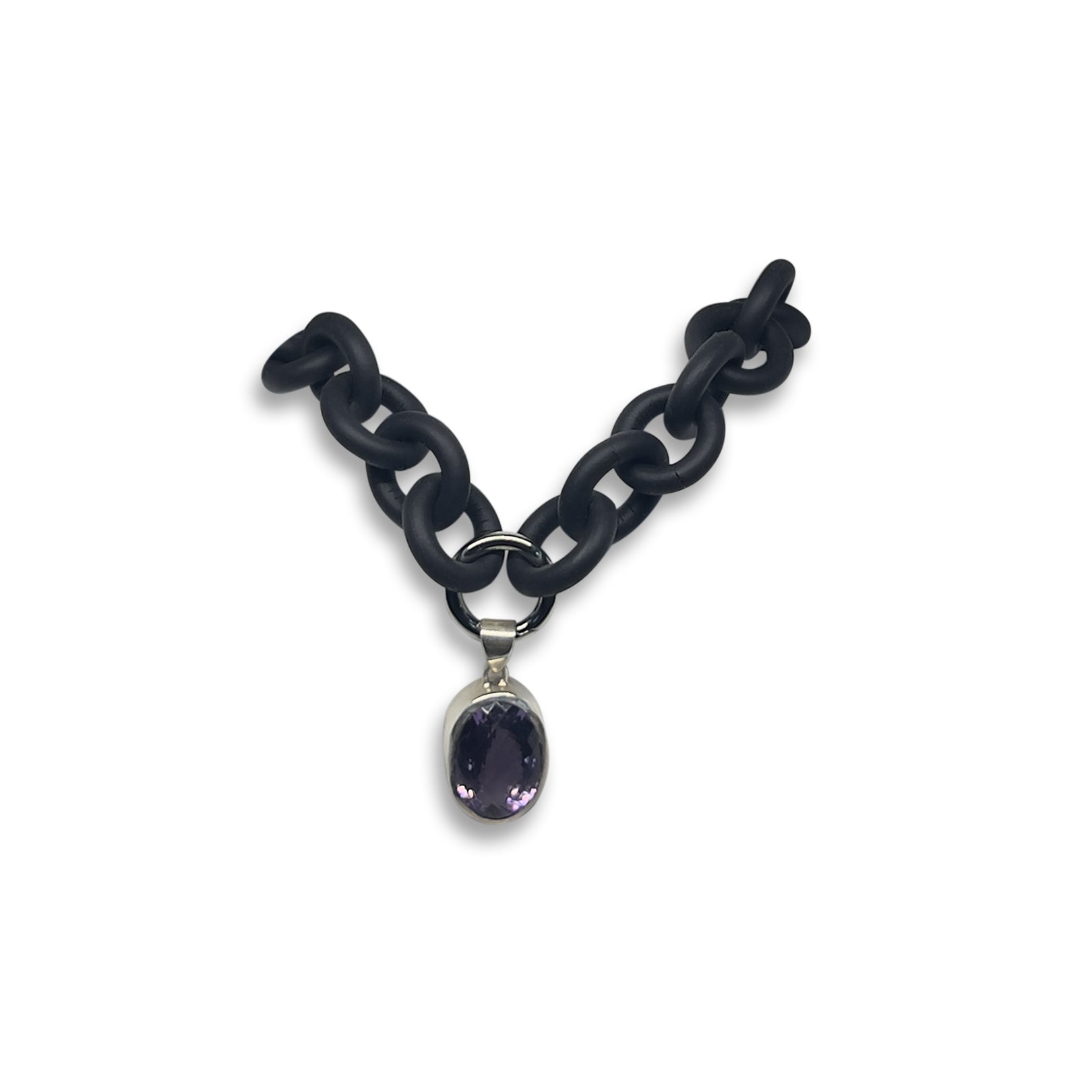 BLACK RUBBER NECKLACE WITH PENDENT BEZEL SET IN SILVER WITH A LARGE PURPLE AMETHYST STONE.