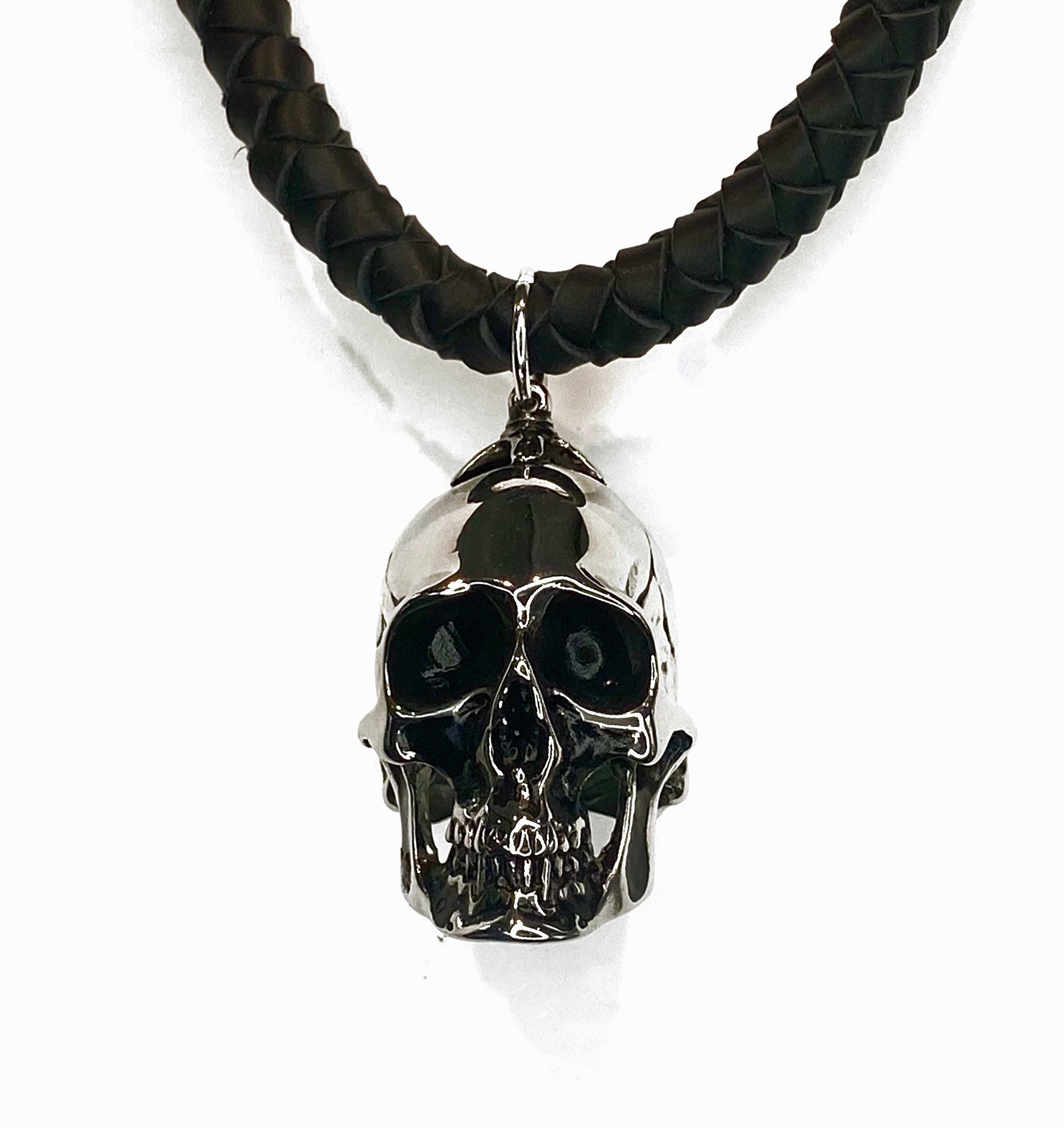 THICK HAND-BRAIDED DEERSKIN LEATHER NECKLACE WITH HEAVYWEIGHT SKULL PENDANT. by nyet jewelry