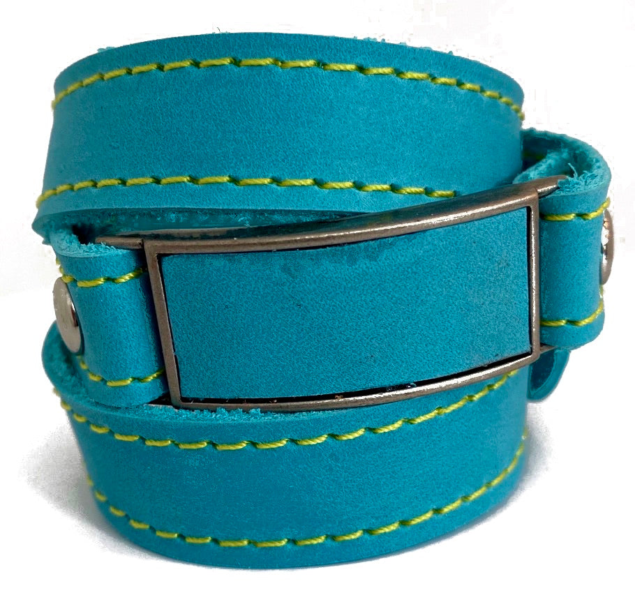 LEATHER WRAPAROUND WITH METAL LINK INLAID WITH MATCHING PIECE OF LEATHER WITH CUSTOM ENGRAVING by nyet jewelry Edit alt text
