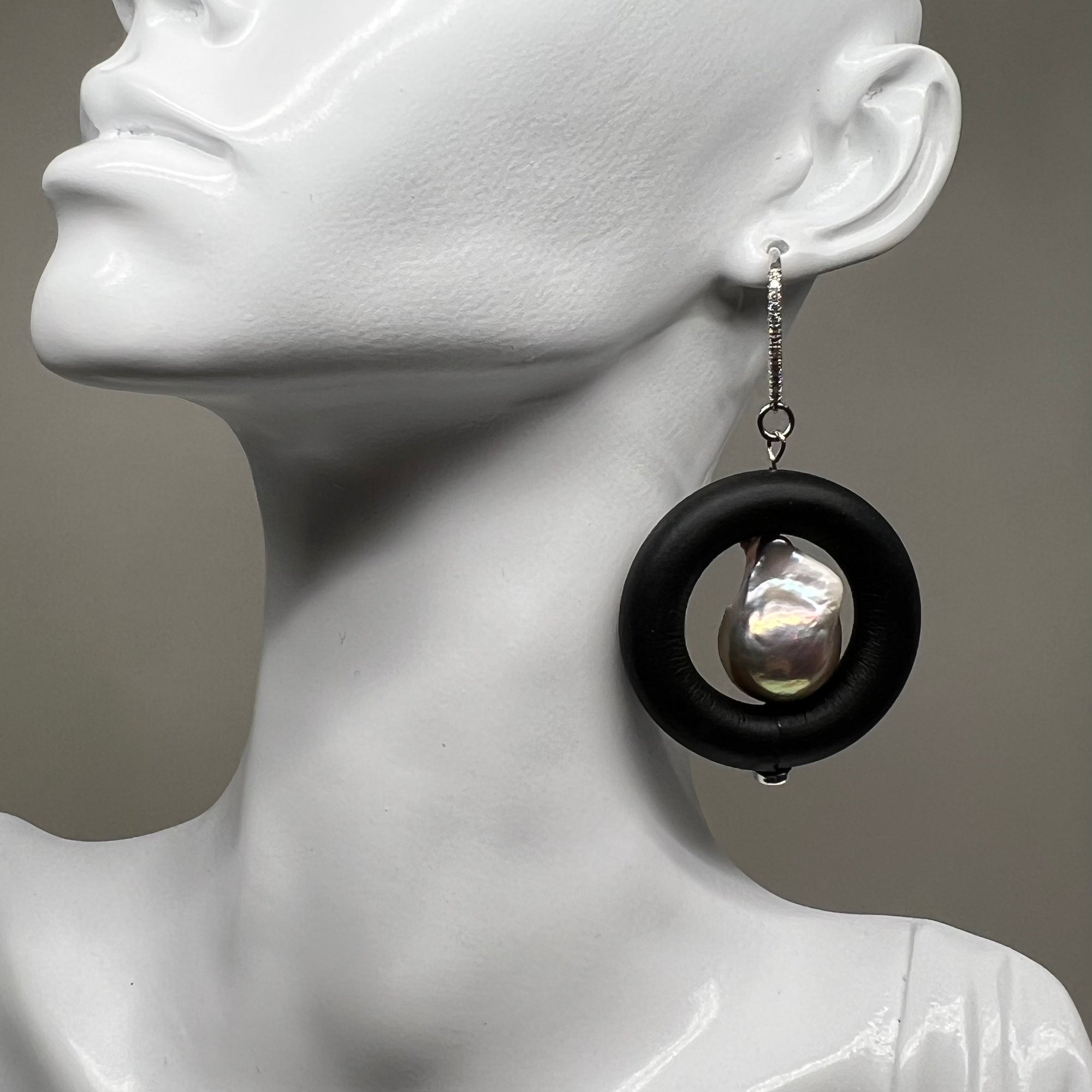 BLACK RUBBER EARRINGS WITH GENUINE BAROQUE PEARLS AND SILVER ENDCAPS. by nyet jewelry