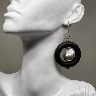 BLACK RUBBER EARRINGS WITH GENUINE BAROQUE PEARLS AND SILVER ENDCAPS. by nyet jewelry