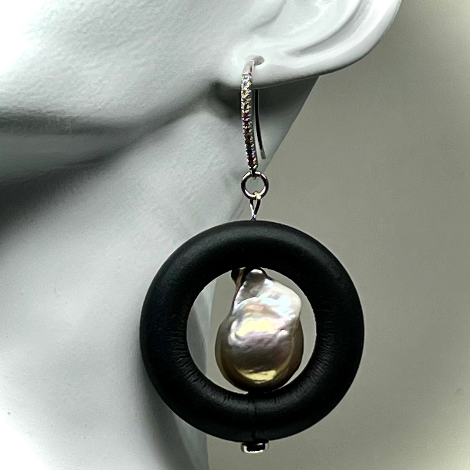 BLACK RUBBER EARRINGS WITH GENUINE BAROQUE PEARLS AND SILVER ENDCAPS. by nyet jewelry