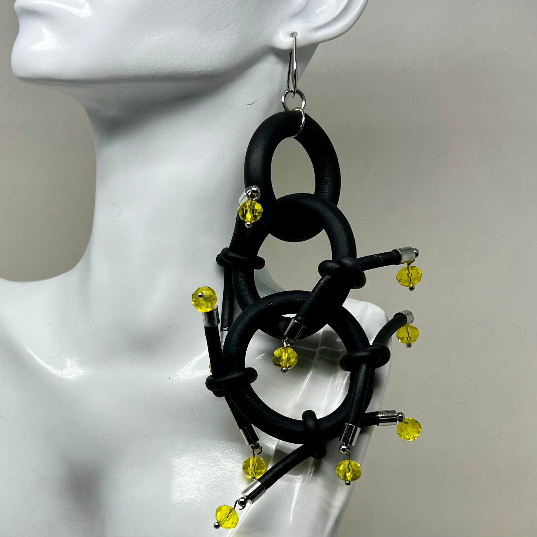 BLACK RUBBER EARRINGS WITH SILVER OR GOLD METAL PARTS AND GLASS BEADS. by nyet jewelry