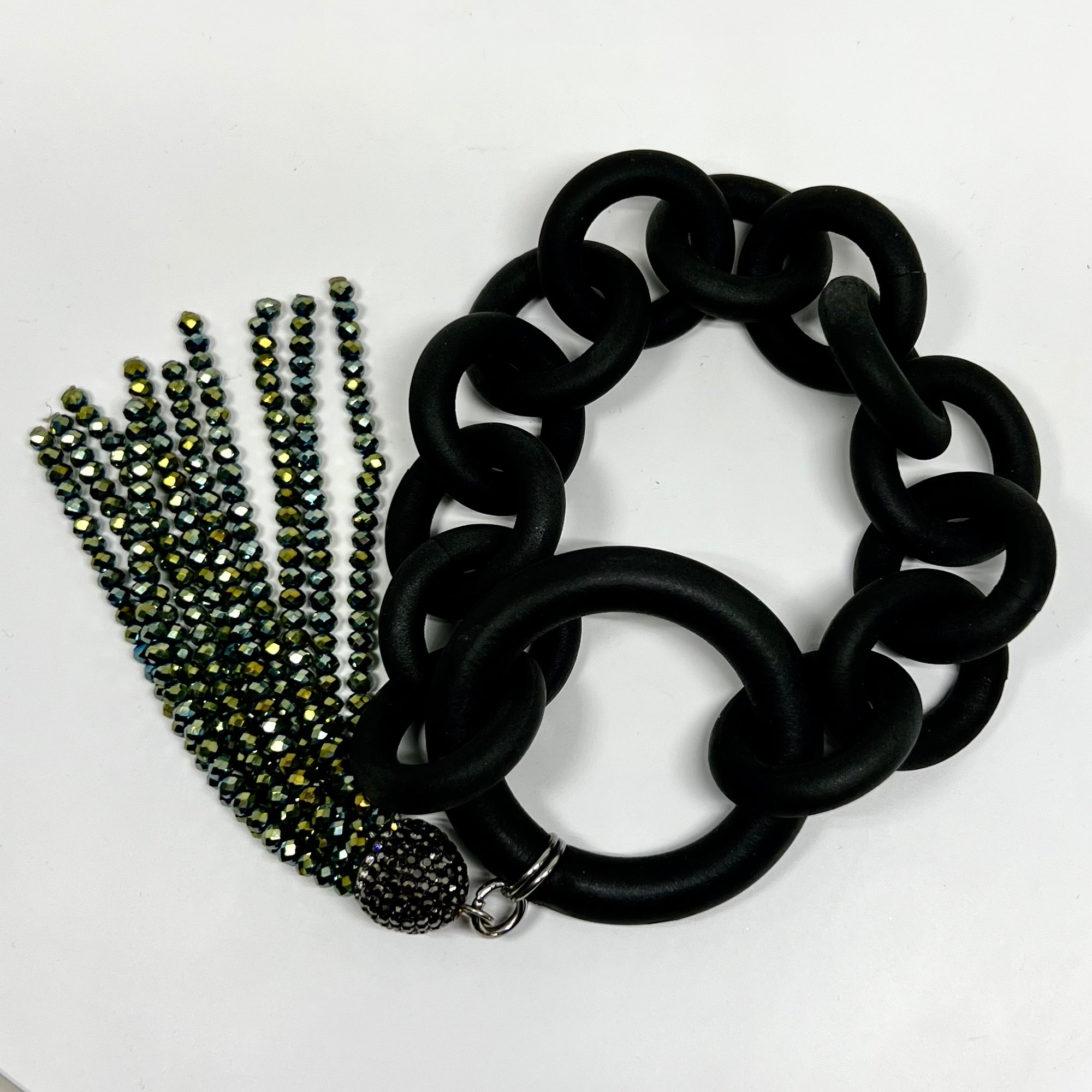 BLACK RUBBER BRACELET WITH A LONG TASSEL MADE OF AUSTRIAN CRYSTALS IN PEACOCK COLORING. by nyet jewelry