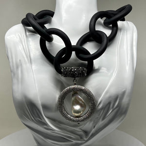 BLACK RUBBER NECKLACE WITH GENUINE LARGE BAROQUE PEARL SET INSIDE A PAVE'S CZ CIRCLE PENDENT. by nyet jewelry