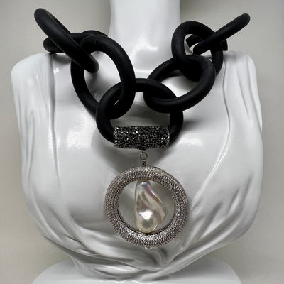 BLACK RUBBER NECKLACE WITH GENUINE LARGE BAROQUE PEARL SET INSIDE A PAVE'S CZ CIRCLE PENDENT. by nyet jewelry