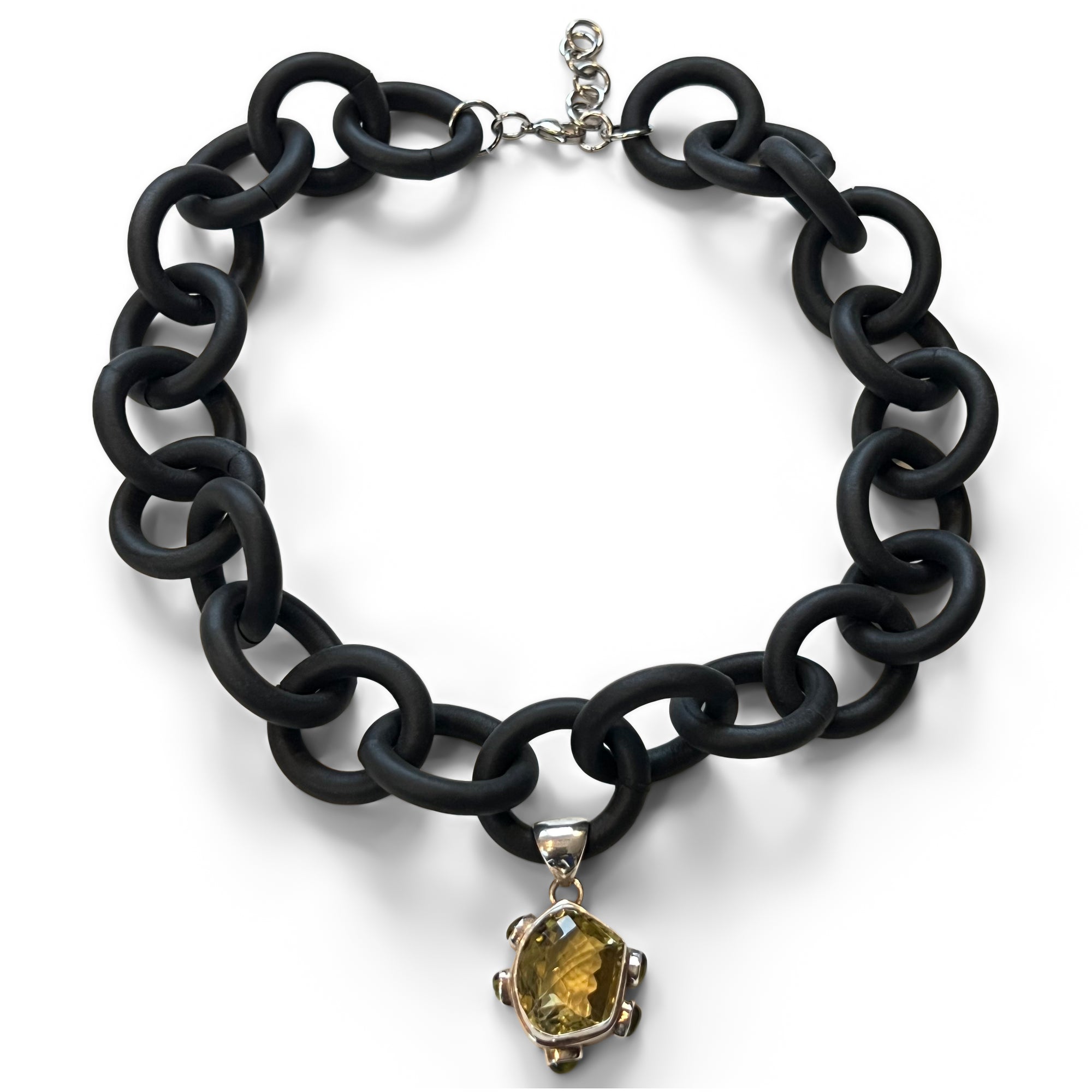 BLACK RUBBER NECKLACE WITH PENDENT BEZEL SET IN SILVER WITH A CITRINE AND PERIDOTS. by nyet jewelry