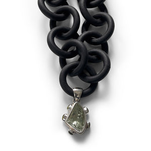 BLACK RUBBER NECKLACE WITH PENDENT BEZEL SET IN SILVER WITH A GREEN AMETHYST AND PERIDOTS. by nyet jewelry