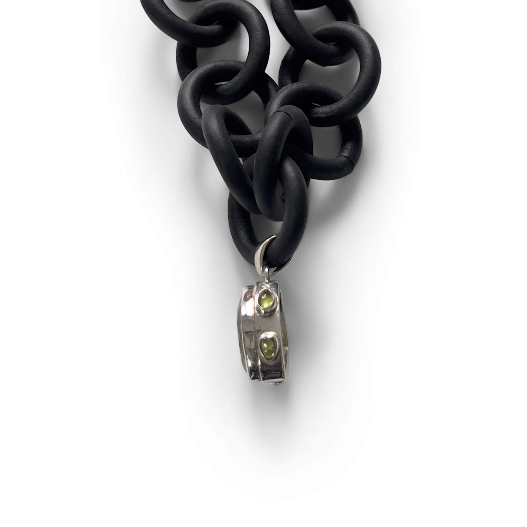 BLACK RUBBER NECKLACE WITH PENDENT BEZEL SET IN SILVER WITH A CITRINE AND PERIDOTS. by nyet jewelry