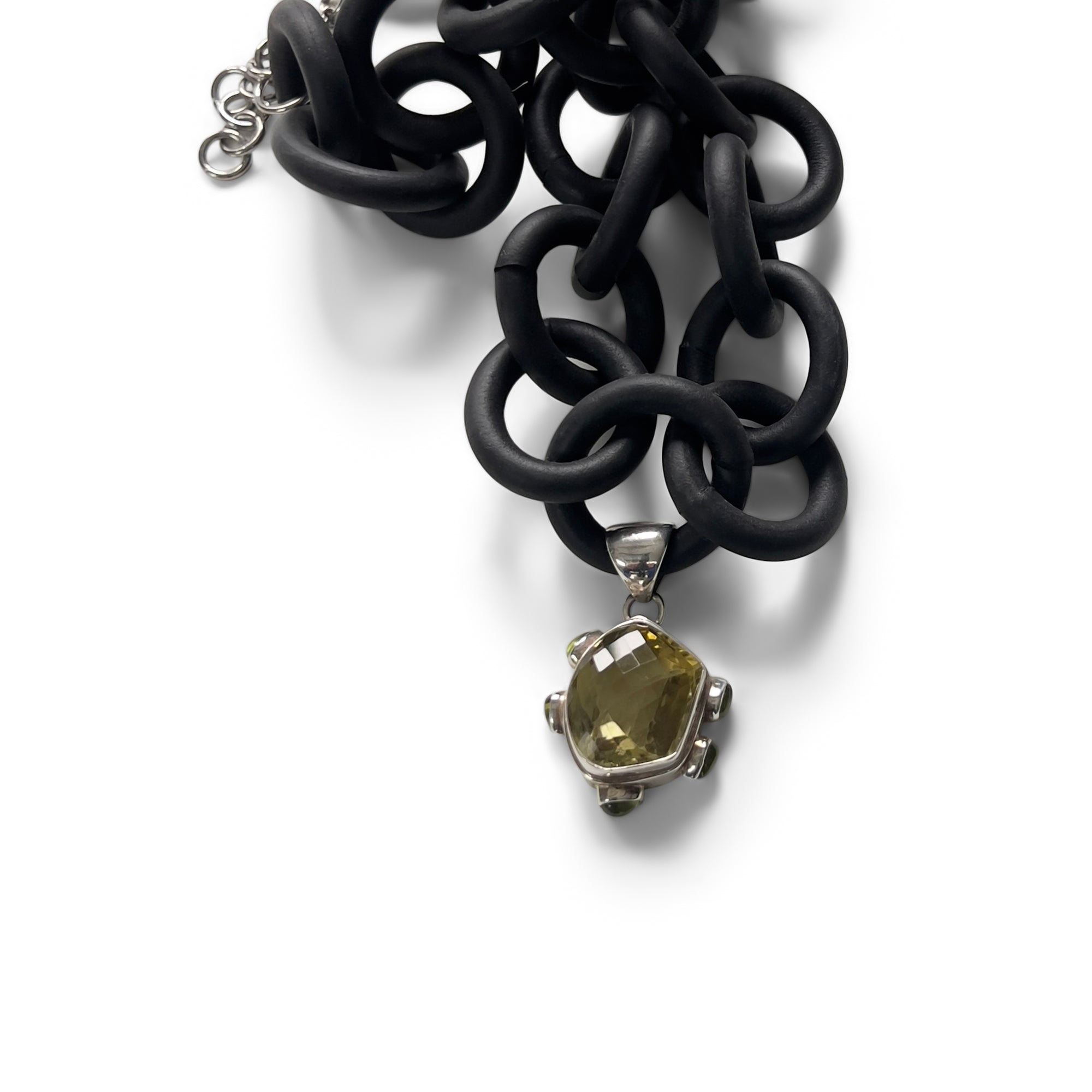 BLACK RUBBER NECKLACE WITH PENDENT BEZEL SET IN SILVER WITH A CITRINE AND PERIDOTS. by nyet jewelry