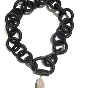 BLACK RUBBER NECKLACE WITH GENUINE LARGE BAROQUE PEARL ATTACHED TO A BAIL PAVE'S WITH AUSTRIAN CRYSTALS. BY NYET JEWELRY