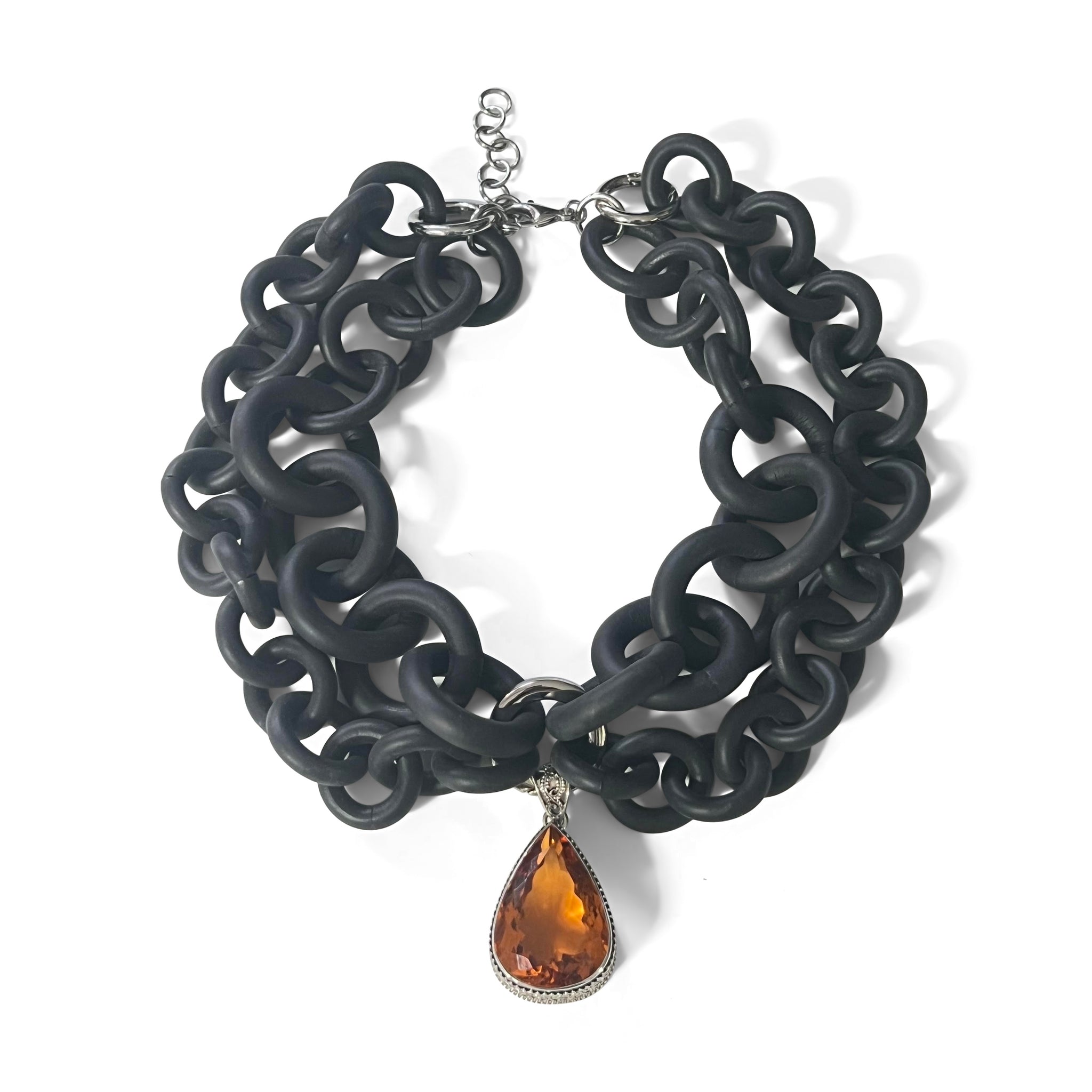 2-STRAND BLACK RUBBER NECKLACE WITH AN ORANGE QUARTZ STONE WRAPPED IN FILIGREE SILVER. by NYET Jewelry.