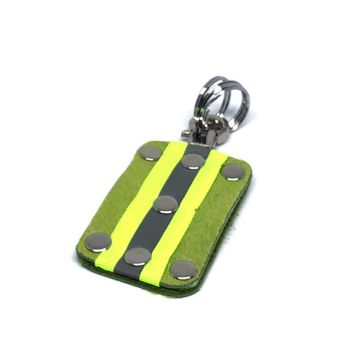 HAIR-ON COWHIDE WITH NEON YELLOW AND SILVER REFLECTIVE BAND KEY CHAIN. By NYET Jewelry.