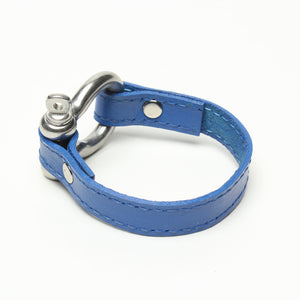 SIGNATURE STITCHED LEATHER AND STAINLESS STEEL SHACKLE BY NYET JEWELRY.