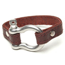 SIGNATURE STITCHED LEATHER AND STAINLESS STEEL SHACKLE BY NYET JEWELRY.