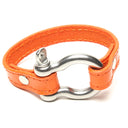SIGNATURE STITCHED LEATHER AND STAINLESS STEEL SHACKLE BY NYET JEWELRY.