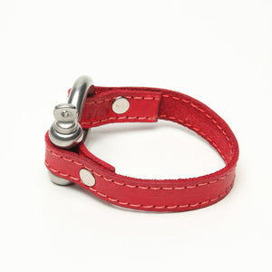 SIGNATURE STITCHED LEATHER AND STAINLESS STEEL SHACKLE BY NYET JEWELRY.