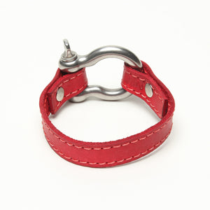 SIGNATURE STITCHED LEATHER AND STAINLESS STEEL SHACKLE BY NYET JEWELRY.