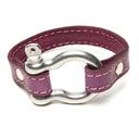 SIGNATURE STITCHED LEATHER AND STAINLESS STEEL SHACKLE BY NYET JEWELRY.