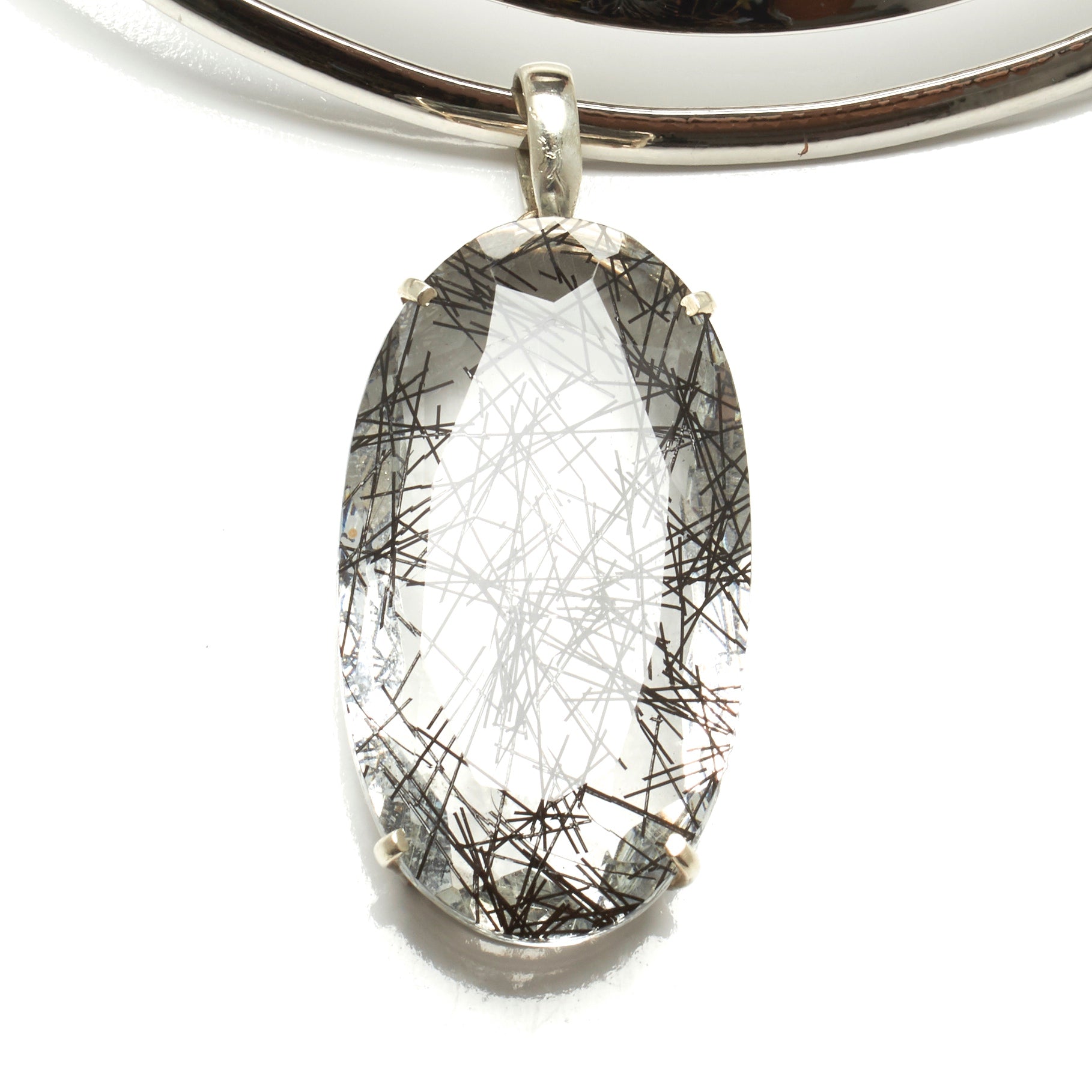 THICK TORQUE NECKLACE WITH LARGE TOURMALINATED QUARTZ PENDENT. BY NYET JEWELRY