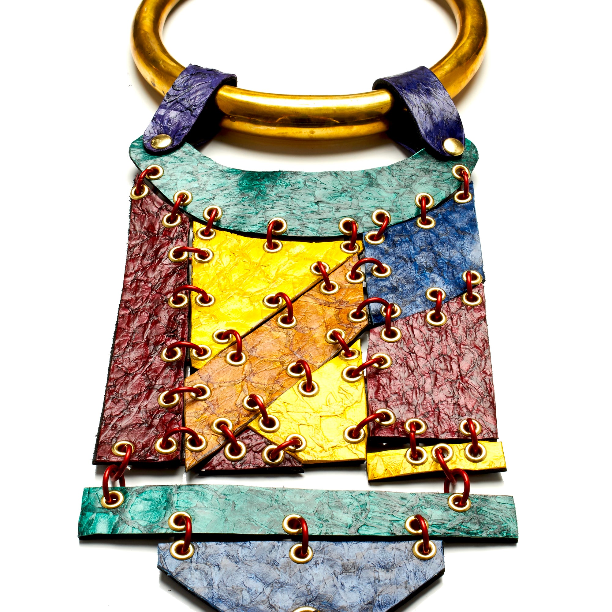 THICK ROUND SOLID BRASS TORQUE NECKLACE WITH HINGED PANELS MADE OF FISH LEATHER WITH DEERSKIN TASSEL BY NYET JEWELRY.