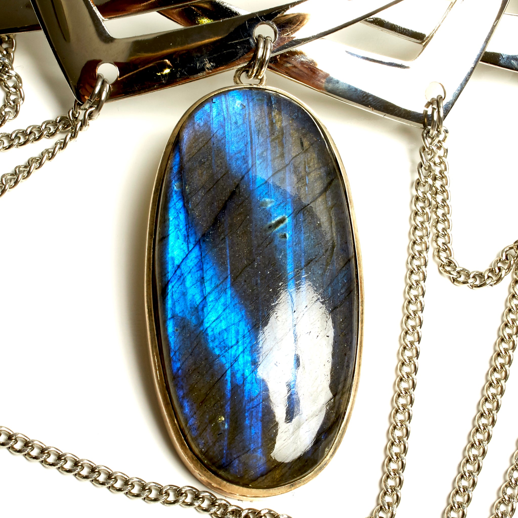 INTRICATE TORQUE NECKLACE WITH CHAINS AND LARGE LABRADORITE STONE PENDENT. by nyet jewelry.