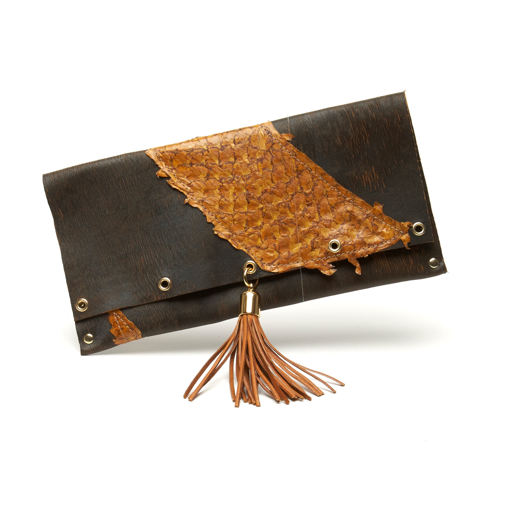 LASER CUT COWHIDE AND FISH LEATHER CLUTCH WITH DEERSKIN TASSEL AND MAGNETIC CLOSURE. by NYET Jewelry