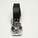 LEATHER BELT WITH HEAVY METAL AND BLACK ENAMEL SKULL BUCKLE ADORNED WITH THICK RING AT BELT LOOP. by NYET Jewelry.