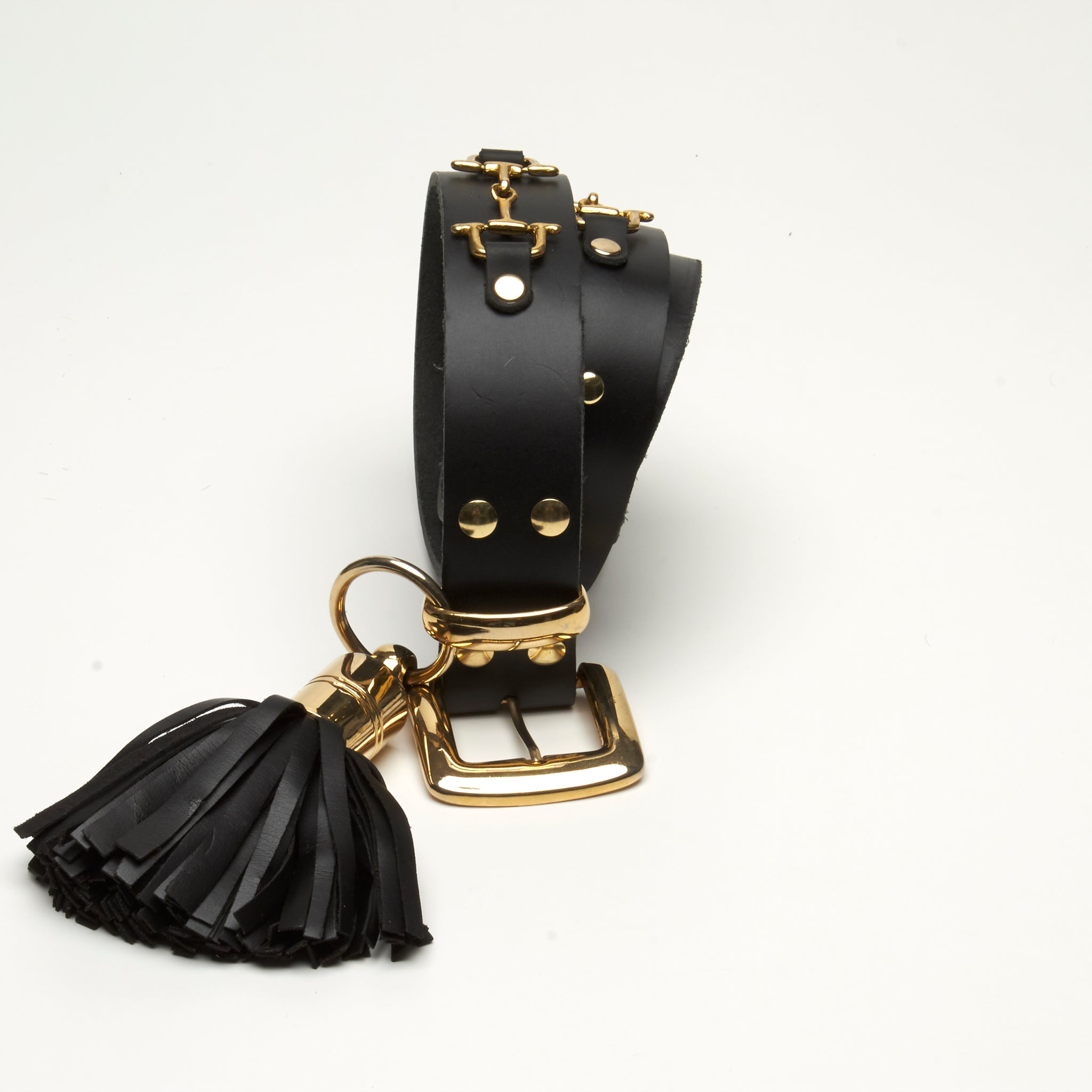 LEATHER, GOLD HORSE BIT D-RING HARDWARE AND TASSEL. by NYET Jewelry.