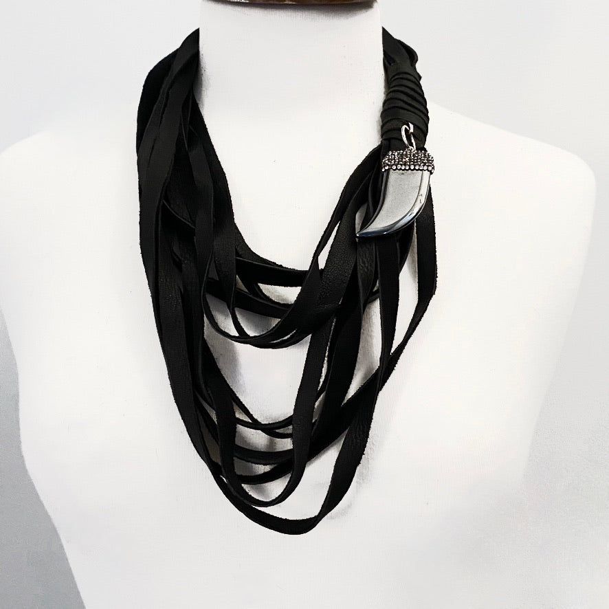 MULTI STRAND DEERSKIN LEATHER NECKLACE WITH PAVE RHINESTONE AND HEMATITE STONE PENDENT.  by nyet jewelry