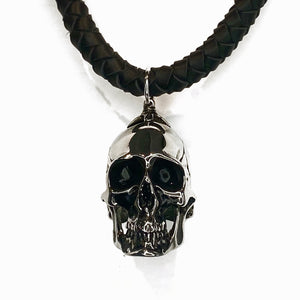 THICK HAND-BRAIDED DEERSKIN LEATHER NECKLACE WITH HEAVYWEIGHT SKULL PENDANT. by nyet jewelry 