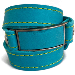 LEATHER WRAPAROUND WITH METAL LINK INLAID WITH MATCHING PIECE OF LEATHER WITH CUSTOM ENGRAVING by nyet jewelry  Edit alt text