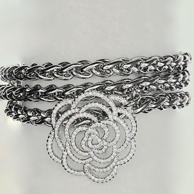 STAINLESS STEEL BRACELET ADORNED WITH A VZ PAVE CAMELLIA PENDENT. by nyet jewelry