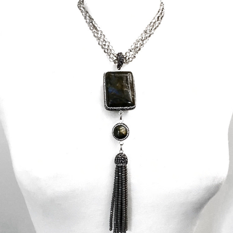 GREY FACETED CRYSTAL BEADS LONG NECKLACE ADORNED WITH EXTRA LARGE CUSHION CUT LABRADORITE STONE W/ PAVE RHINESTONES, LABRADORITE BEAD ACCENT AND CRYSTAL BEADS TASSEL.  by nyet jewelry