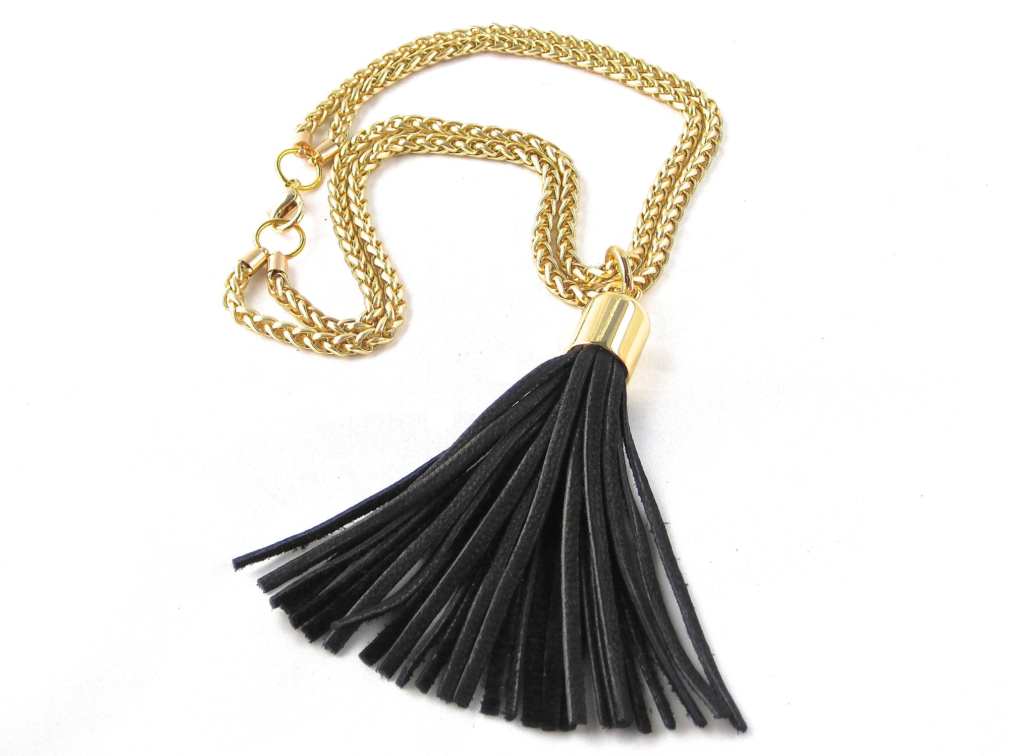 STAINLESS STEEL CHAINS AND LARGE DEERSKIN LEATHER TASSEL NECKLACE  by nyet jewelry.