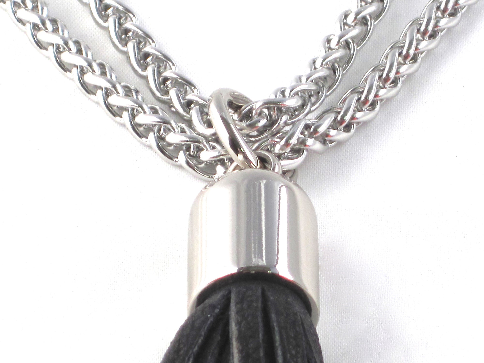 STAINLESS STEEL CHAINS AND LARGE DEERSKIN LEATHER TASSEL NECKLACE  by nyet jewelry.