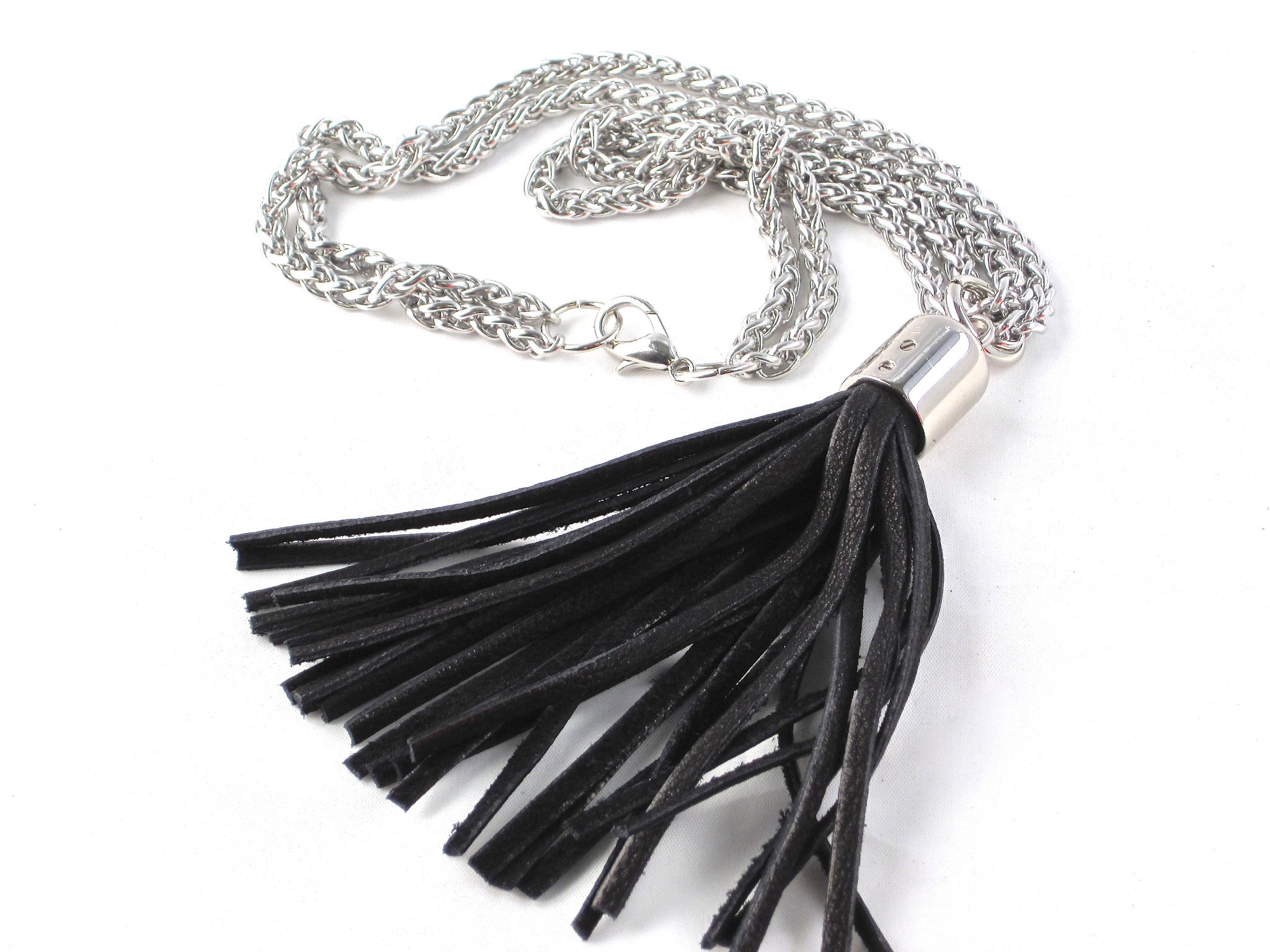 STAINLESS STEEL CHAINS AND LARGE DEERSKIN LEATHER TASSEL NECKLACE  by nyet jewelry.