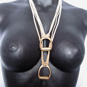 STIRRUP AND SUEDE NECKLACE BY NYET JEWELRY.