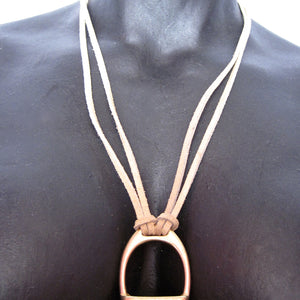 STIRRUP AND SUEDE NECKLACE BY NYET JEWELRY.