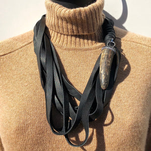 MULTI STRAND DEERSKIN LEATHER NECKLACE WITH PAVE RHINESTONE AND HORN PENDENT. by NYET Jewelry