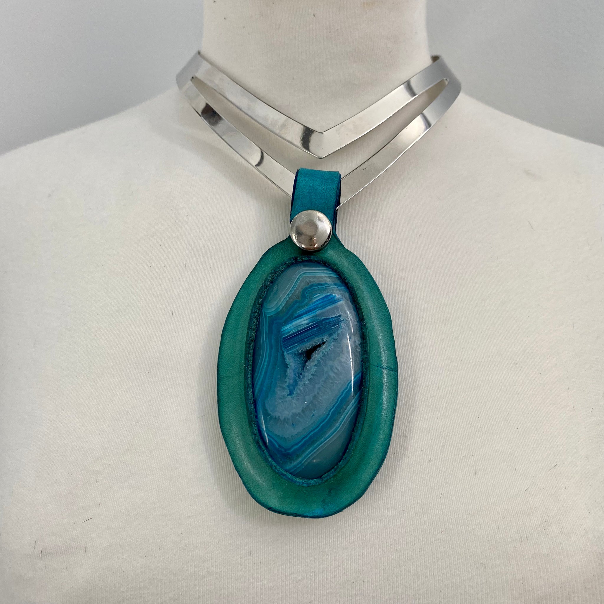 Metal torque necklace with oversized solar quartz stone pendent