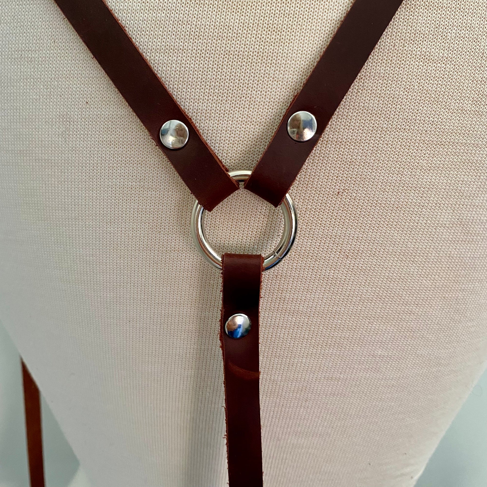 LEATHER BELT WITH DETACHABLE SUSPENDERS AND DANGLING STRAPS. by nyet jewelry