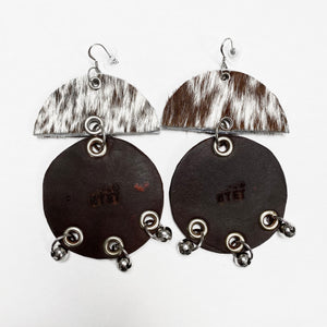 WIDE HAIR-ON AND TANNED COWHIDE EARRINGS WITH SEMI CIRCLE  AND LARGE CIRCLE PENDANTS ADORNED WITH STAINLESS STEEL BEADS. by NYET Jewelry