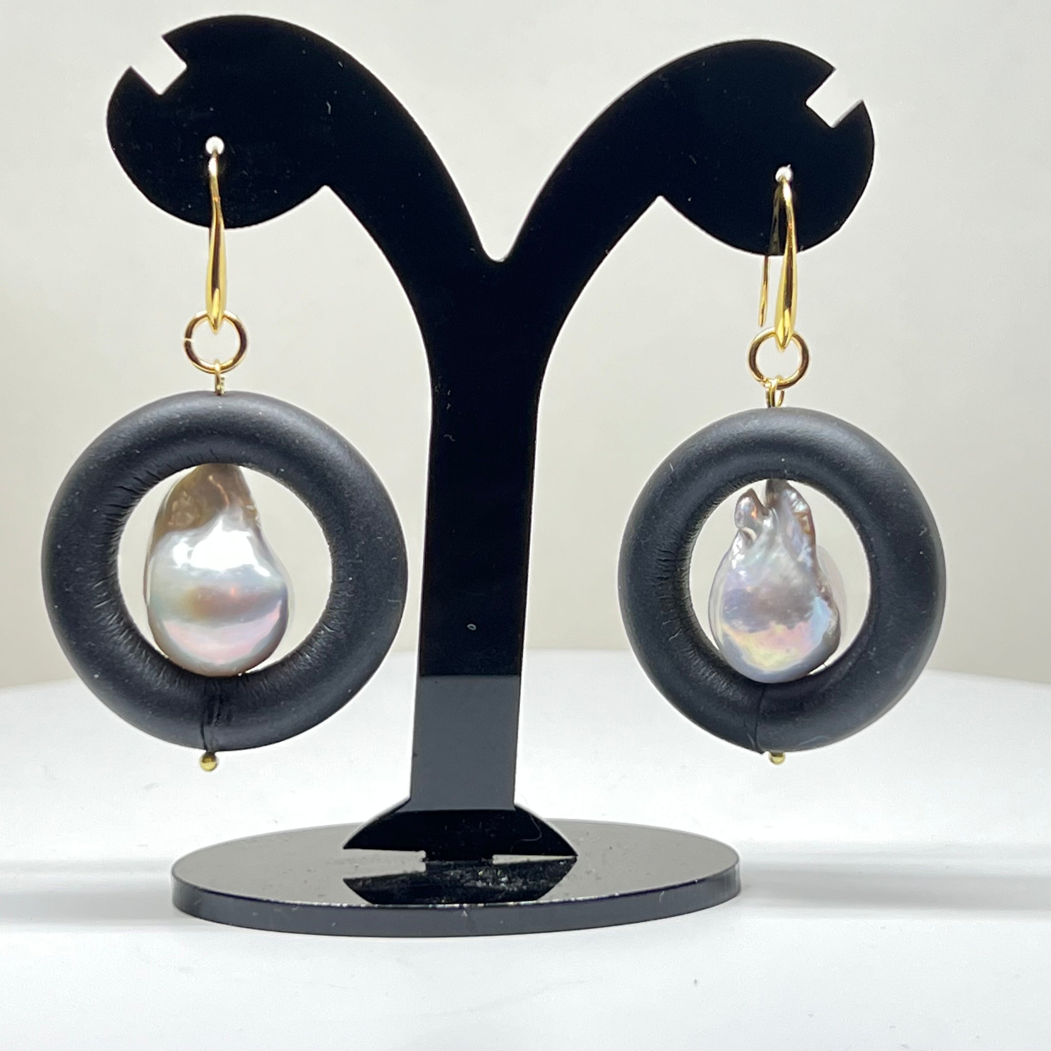 BLACK RUBBER EARRINGS WITH GENUINE BAROQUE PEARLS AND GOLD ENDCAPS. by nyet jewelry
