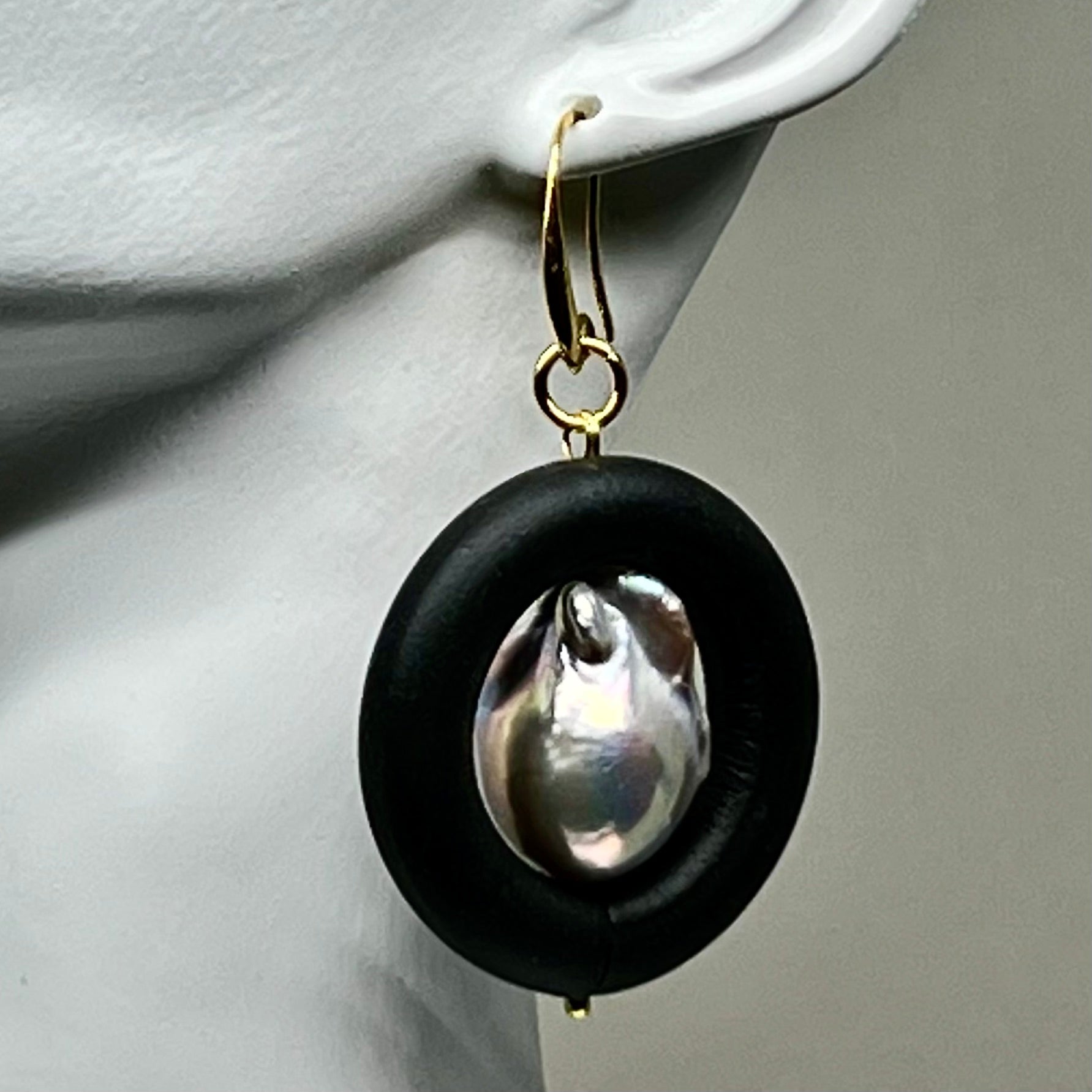 BLACK RUBBER EARRINGS WITH GENUINE BAROQUE PEARLS AND GOLD ENDCAPS. by nyet jewelry